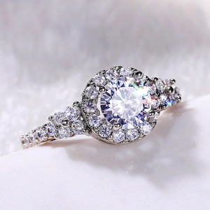 Elegant silver halo engagement ring featuring a large round brilliant cut zircon center stone