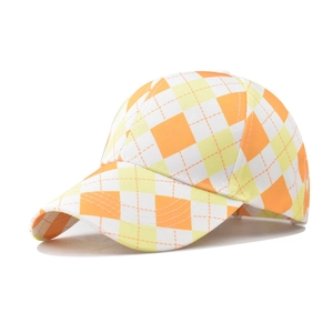 Detailed view of orange and yellow diamond check pattern stitching on a baseball cap