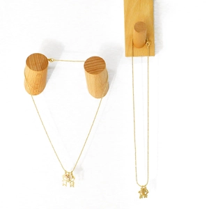 Minimalist gold couple necklaces featuring cartoon boy and girl pendants with crystals