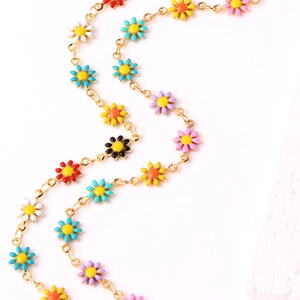 18K gold plated necklace with colorful enamel daisy pendants on a white background