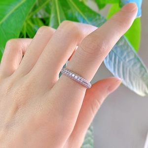 Detail of S925 silver eternity ring with three rows of sparkling pave set zircons