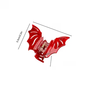 Close-up of red bat wing hair claw clip with dimensions 8.5cm x 5.5cm x 3.3cm