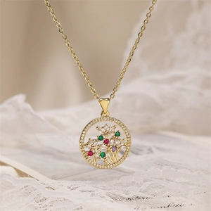 Macro shot of gold tree of life pendant with colorful zircons on white lace fabric