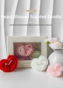 Detailed view of rose petal heart scented candles in a premium window gift box