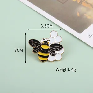 Cute cartoon bee and honeycomb enamel brooch in yellow and black with golden details