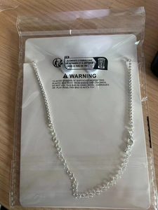 Silver bridal necklace with crystals and lobster clasp in protective polybag packaging