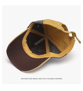 Detail of internal lining and metal buckle on vintage washed canvas baseball cap