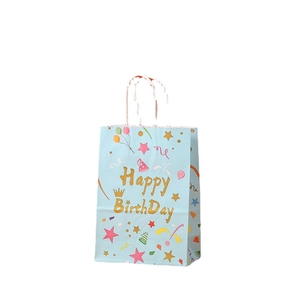 Light blue kraft paper gift bag with golden Happy Birthday text and party icons