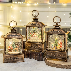 Vintage bronze Christmas lanterns with snow globes and Santa miniature scenes