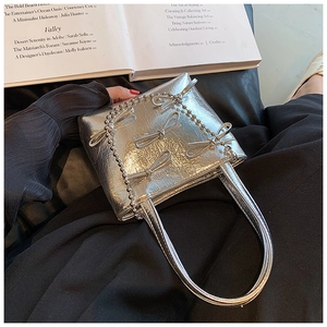 Silver metallic tote bag featuring wrinkled texture, 3D bows, and bead chain strap