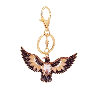 Golden eagle keychain with sparkling rhinestones and black enamel detail in a centered view