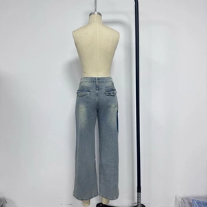 Rear view of low waist wide leg jeans with side contrast panels and back flap pockets