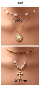 Detail of layered gold stainless steel necklace with pearl cross pendant and beads