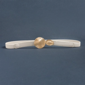 Detailed view of white elastic waist belt featuring textured leather and gold buckle