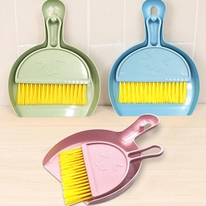 Mini dustpan and brush set with smiley face design in green blue and pink colors