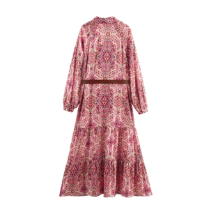 Bohemian floral long sleeve maxi dress with tiered skirt and brown belt on white background