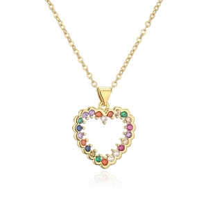 Macro detail of gold necklace with a hollow heart pendant set with multicolor gemstones
