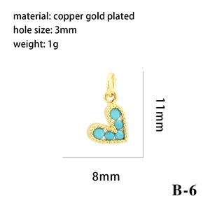 Macro detail of 11x8mm turquoise heart charm in 18K gold-plated copper with B-6 model spec