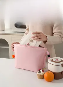 Pink thermal lunch bag with Ali the Fox bento box in a bright kitchen setting