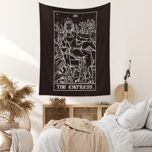 Detail of The Empress tarot tapestry hanging on a bedroom wall as home decor