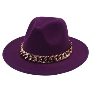 Detail of dark purple fedora hat with a prominent gold acrylic chain band decoration