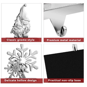 Close-up of metal gnome and snowflake Christmas stocking holders with non-slip base