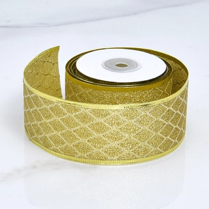 Detailed view of golden argyle pattern ribbon with metallic luster for Christmas decor