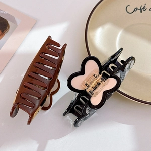 Vintage acetate heart shark hair clips in solid brown and zebra pattern styles