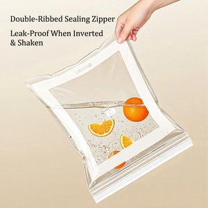 Leakproof food storage bag with double zipper seal holding water and orange slices