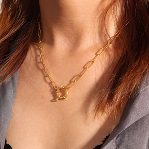 Close-up of 18K gold plated paperclip chain necklace with a large spring ring clasp