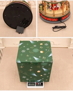 Carousel music box detail showing USB port, battery compartment and packaging box