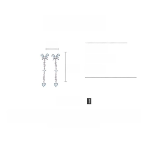Detail view of long tassel butterfly earrings with light blue zircon and silver finish