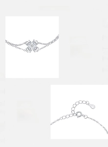Macro detail of S925 sterling silver stamp on clover bracelet with zirconia hearts