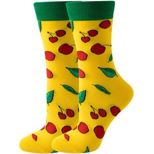 Detailed close-up of yellow socks with red cherry patterns and green ribbed cuffs