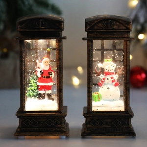 Christmas lanterns with Santa and snowman featuring vintage bronze finish and snowflake effect