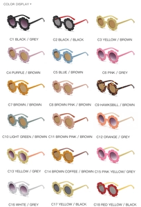 Grid display of 18 colorful sunflower-shaped round sunglasses for kids in various colors
