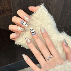 Winter Christmas press-on nails with 3D snowman, glitter, and snowflakes art