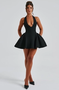 Detail of a black deep V-neck halter dress featuring a slim waist and high-quality fabric