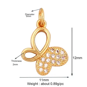 Detail of a gold butterfly pendant with white zircon inlays and precise dimensions