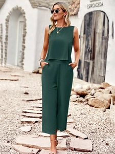 Detail of dark green two-piece set with sleeveless top and wide-leg cropped trousers