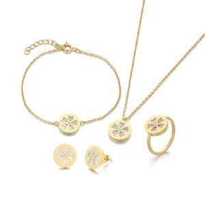 Golden four-leaf clover jewelry set with necklace, bracelet, earrings and ring