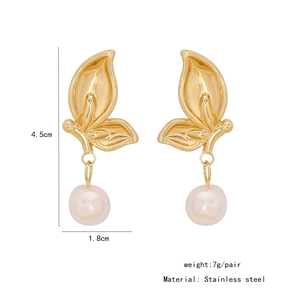 Detailed view of gold butterfly earrings with pearls, 4.5cm height and stainless steel finish
