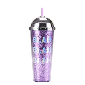 Detail of purple glitter straw cup with chrome lid and holographic BLAH BLAH BLAH text