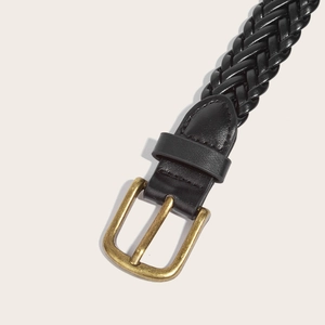 Woven black leather belt with golden square buckle and smooth finish on light background