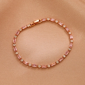 Detail of rose gold bracelet featuring pink rectangular and white round zircons