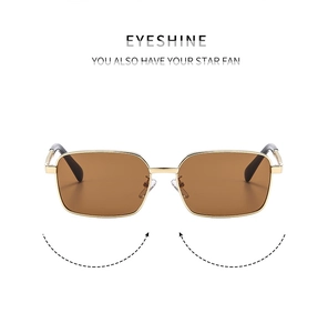Detail of vintage square metal sunglasses frame with engraved temple hinges and gold finish
