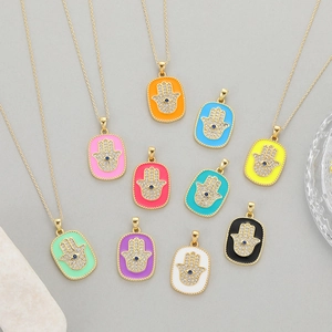 Colorful enamel Hamsa hand pendant necklaces with sapphire eye and cubic zirconia detail
