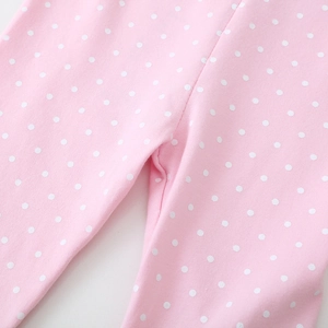 Toddler girls pink leggings with white polka dots made of soft elastic cotton fabric
