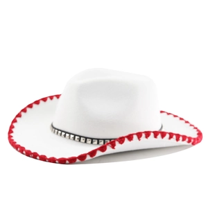 Detailed side view of white wool fedora hat featuring red woven edge and studded black band