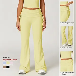 Light yellow high-waisted yoga flare pants with fold-over waistband and side drawstring